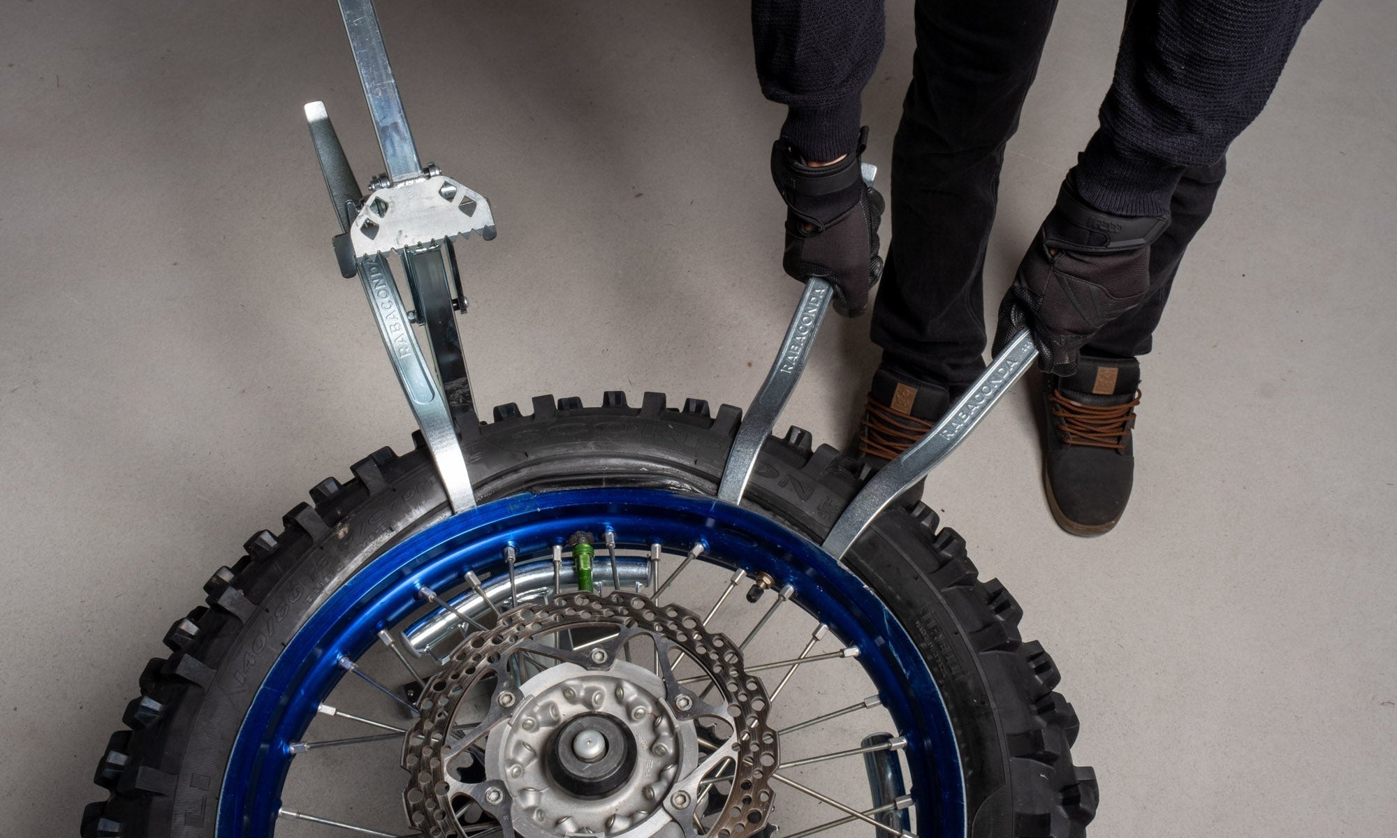 Portable dirt bike tire changer set up at home for smooth, hassle-free tire changes